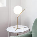 Gold simple metal brackets opal glass table lights